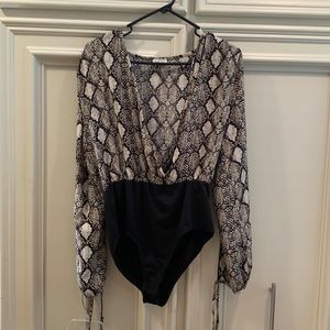 peach love bodysuit size large animal print long sleeves that are open with ties